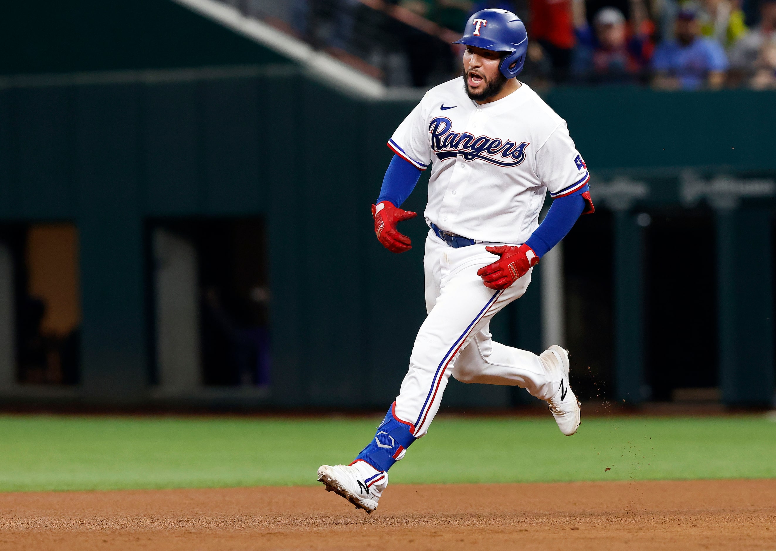 Texas Rangers batter Jose Trevino (23) celebrates his two-run homer off of Boston Red Sox...