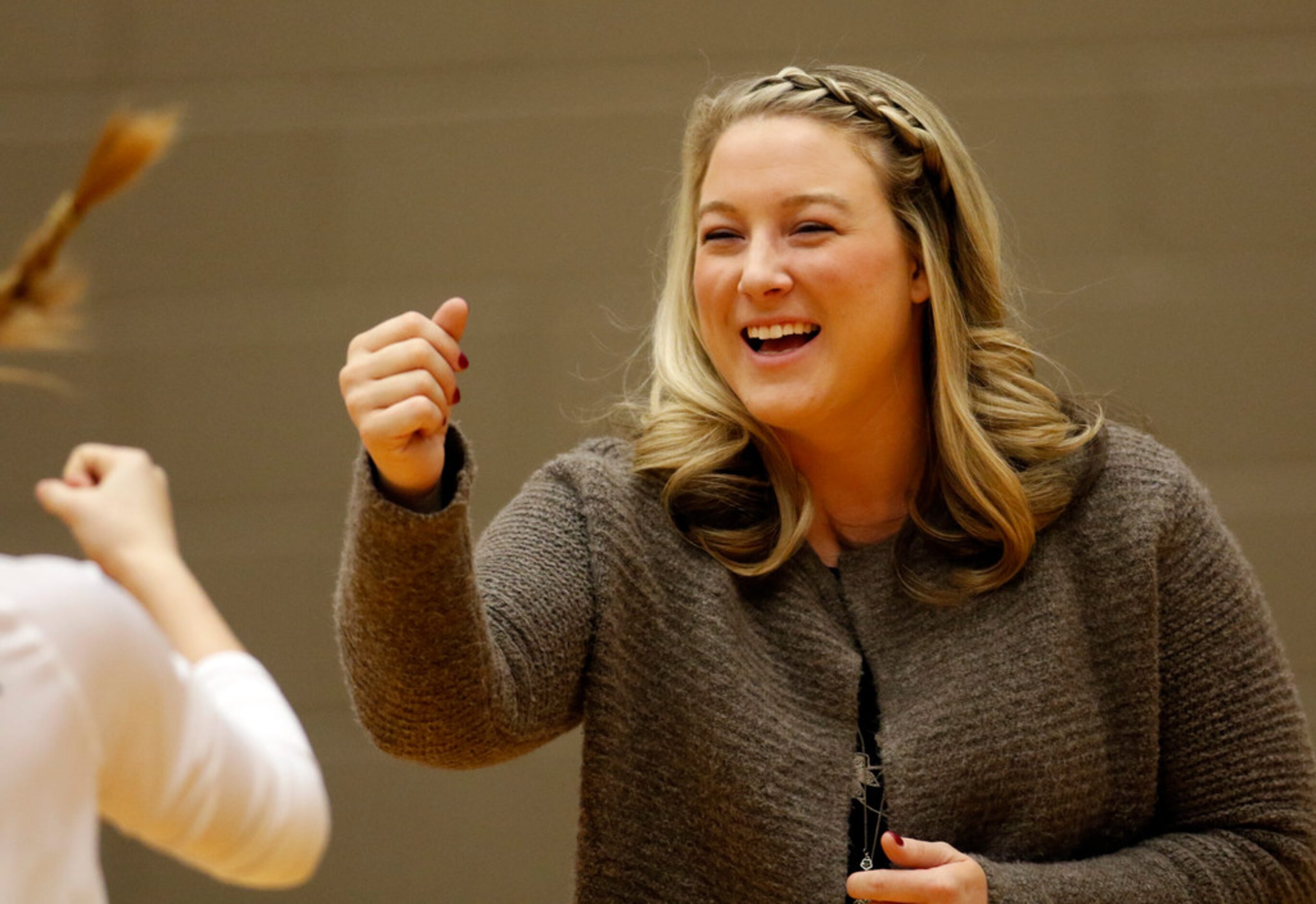 Trophy Club Byron Nelson head coach Brianne Barker-Groth greets players from Denton Guyer...