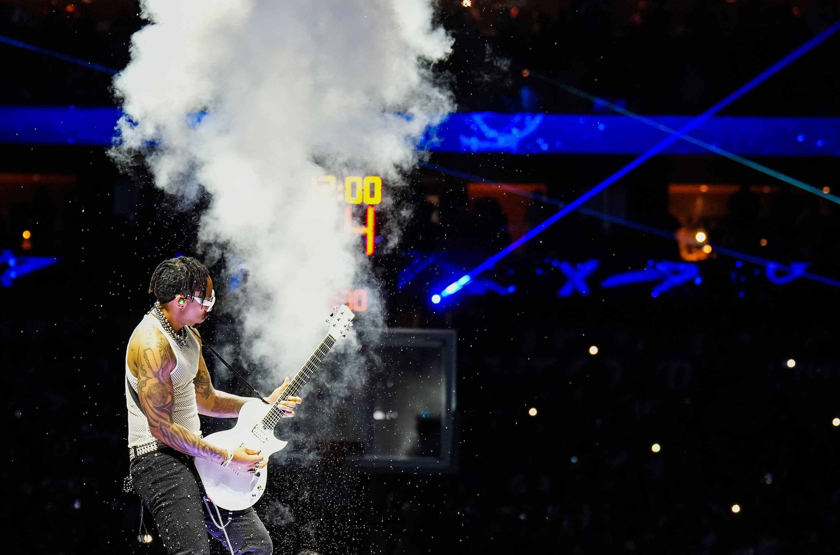 Guitarist Justin Lyons plays during player introductions performs before Game 4 of an NBA...