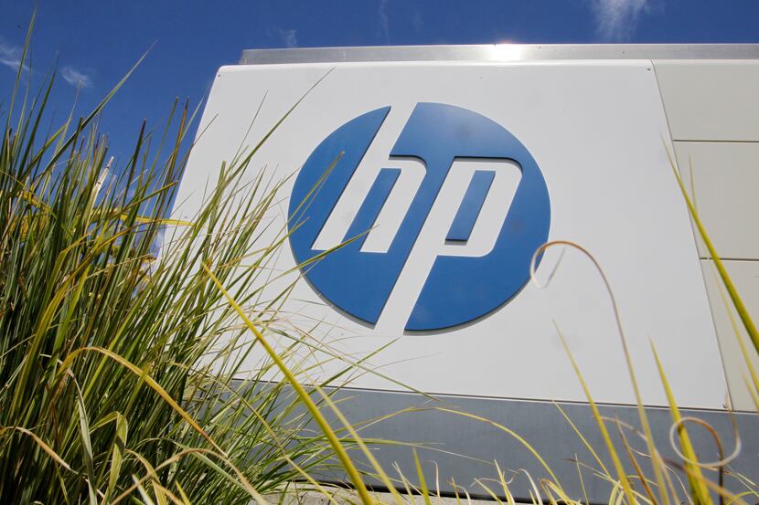FILE - In this Aug. 21, 2012, file photo, the Hewlett-Packard Co. logo is seen outside the...