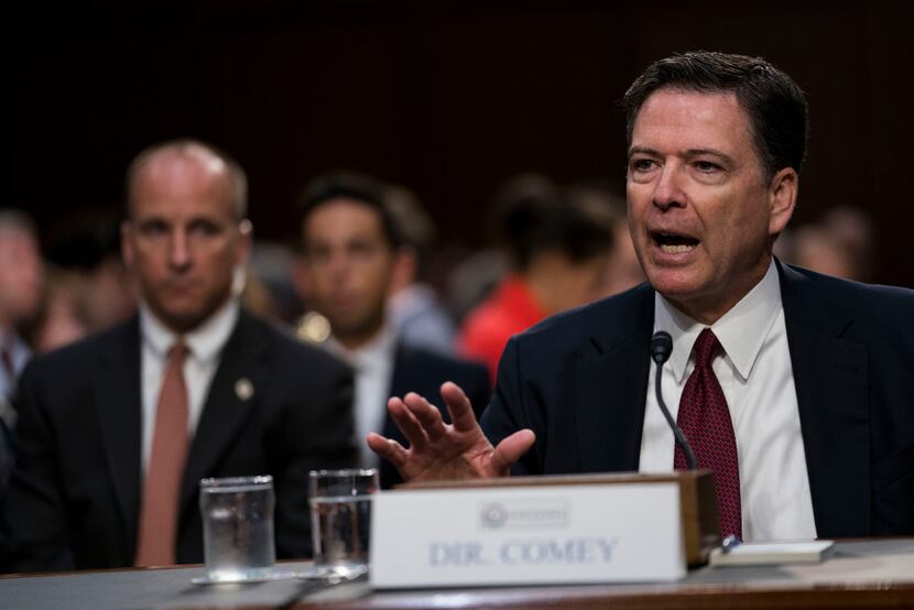 Former FBI Director James Comey testifies during a Senate Intelligence Committee hearing on...