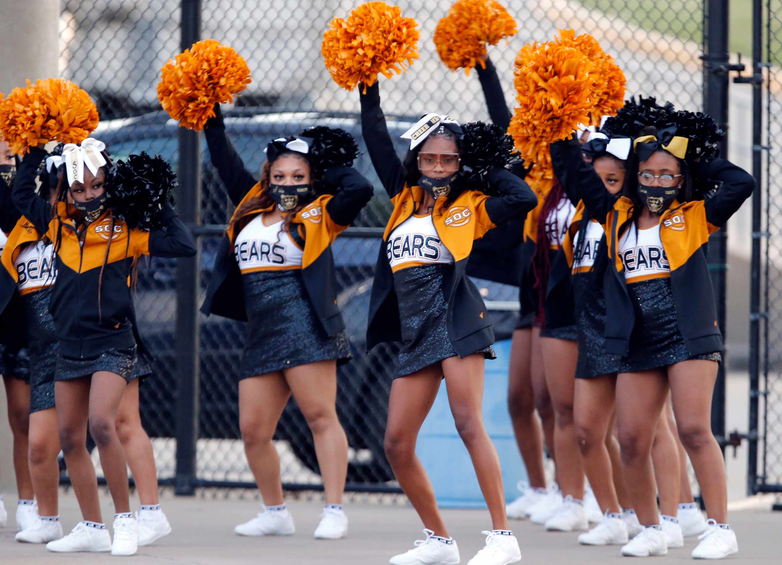 The South Oak Cliff cheerleaders warm up to music before the start of the first half of high...