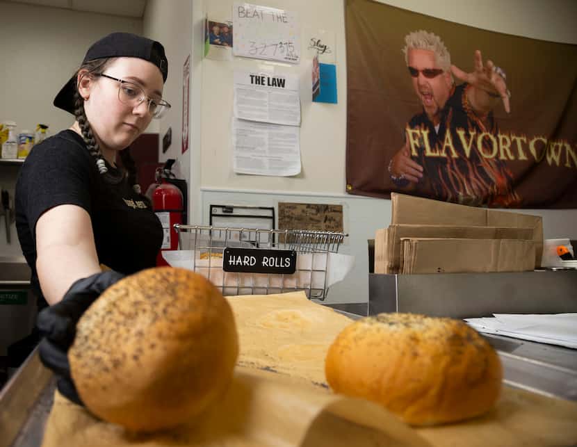 Assistant manager Alanna Carter stocks the Hard Rolls at Dan's Bagels in Trophy Club on...