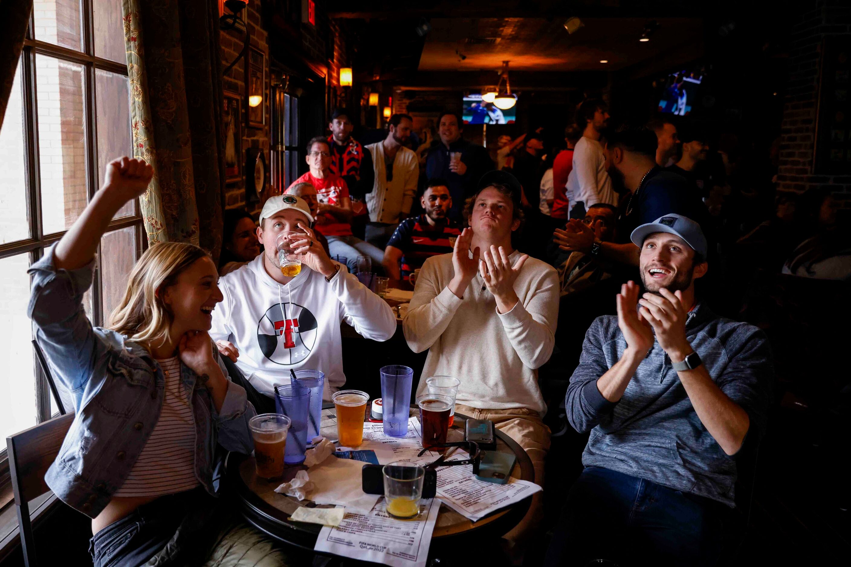 From left, Kacey Baker, Blake Baker, Charles Foose and and Trevis barber, cheer during a...