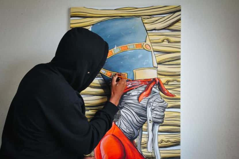 
Bryan Blue creates an acrylic painting on canvas that was inspired by rapper Tupac Shakur's...