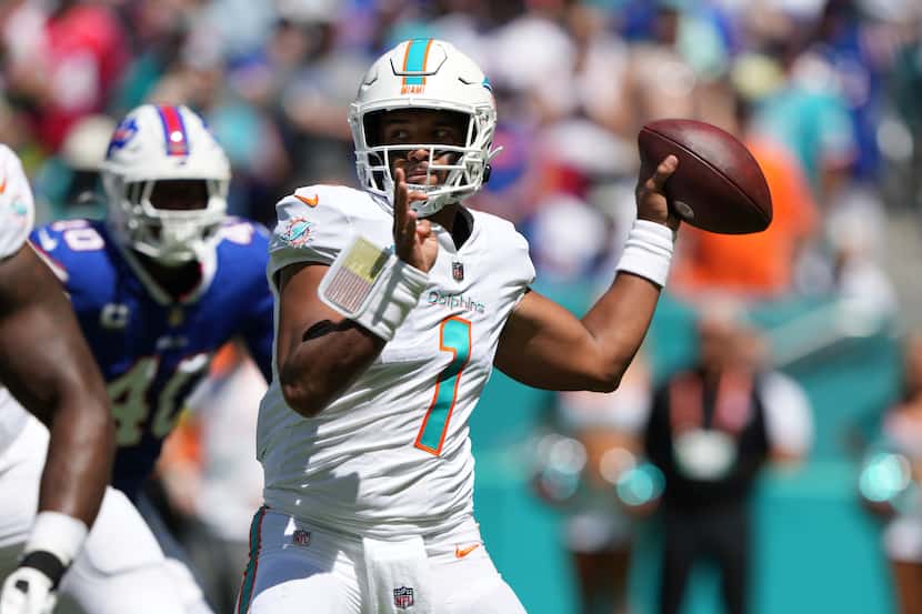 Miami Dolphins quarterback Tua Tagovailoa (1) makes a pass attempt during an NFL football...