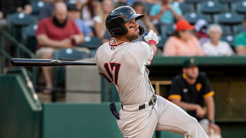 Hickory Crawdad's Ezequiel Duran (17) watches the ball during the game with the Greensboro...