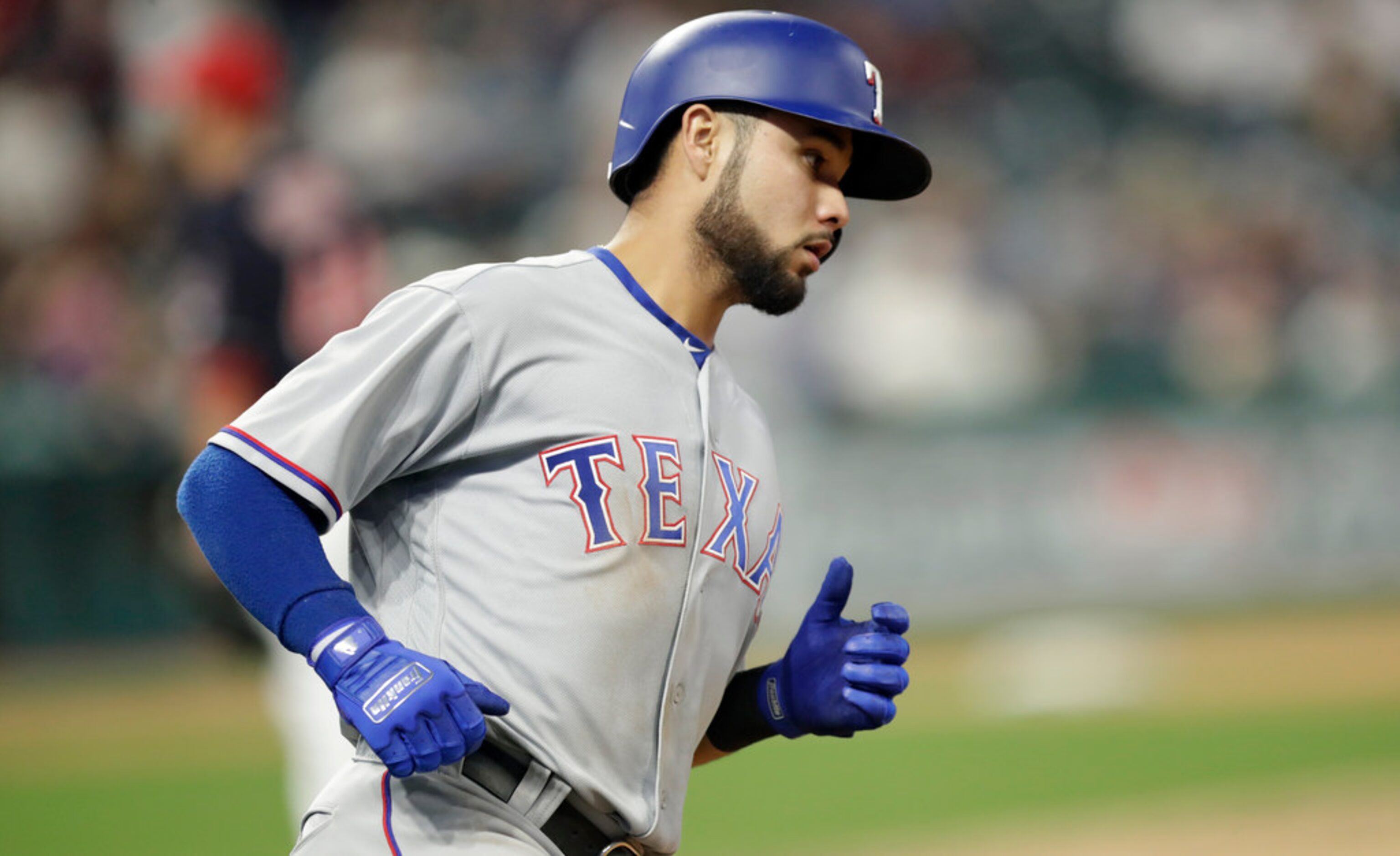 Texas Rangers' Isiah Kiner-Falefa runs the bases after hitting a solo home run off Cleveland...