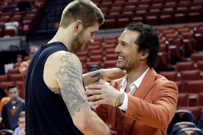Actor Matthew McConaughey, right, visits with Texas forward Dylan Osetkowski before the...