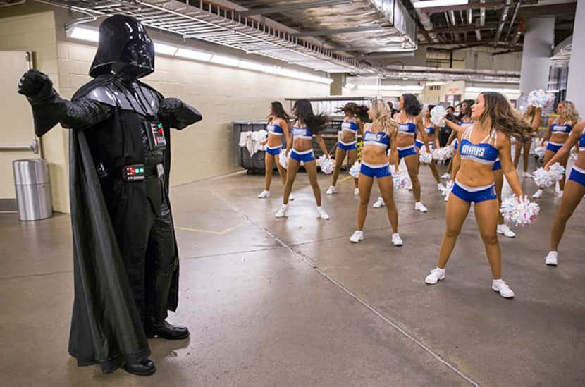  A man dressed as Darth Vader dances in the tunnel while the Dallas Mavericks dancers...