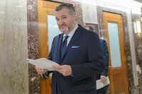 U.S. Sen. Ted Cruz, R-Texas, walks in the Dirksen Senate Office Building on Capitol Hill,...