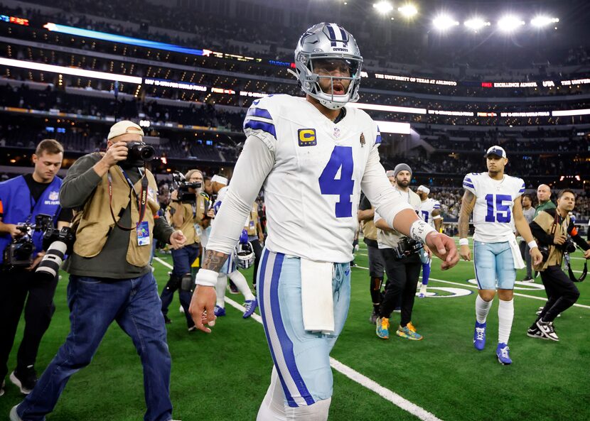 Dallas Cowboys quarterback Dak Prescott (4) walks to the locker room following their Wild...