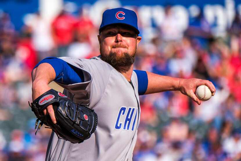 Chicago Cubs starting pitcher Jon Lester throws during the sixth inning against the Texas...