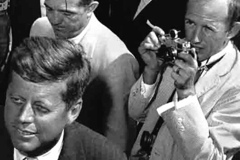 Shel Hershorn (with camera) photographed John F. Kennedy on the campaign trail in 1960.