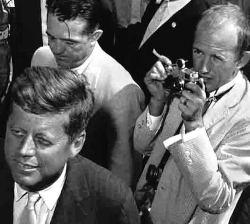 Shel Hershorn (with camera) photographed John F. Kennedy on the campaign trail in 1960.