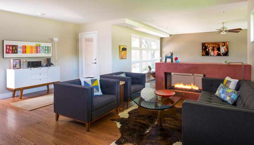 
A ventless gas fireplace in the living area is made of natural earth plaster. “We like open...