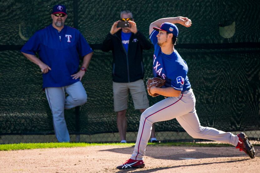 Texas Rangers pitcher Yu Darvish throws from a half pitching mound under eye of Rangers...