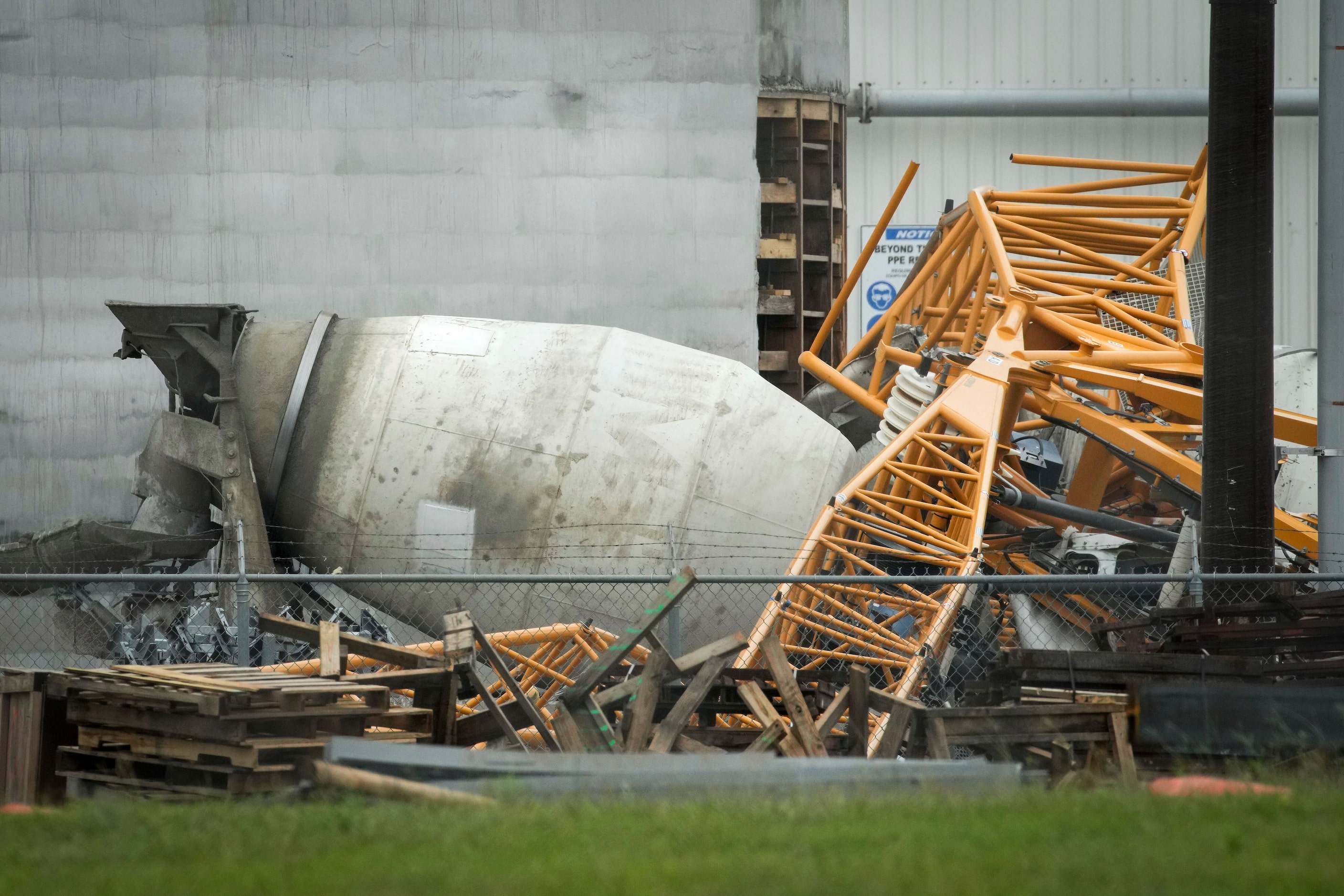 A crane sits on top of a cement truck, Friday, May 17, 2024, in Houston, at an address where...