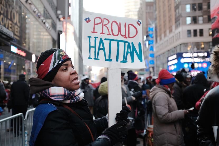 Hundreds of people, many of them Haitian, demonstrate against racism in Times Square on...
