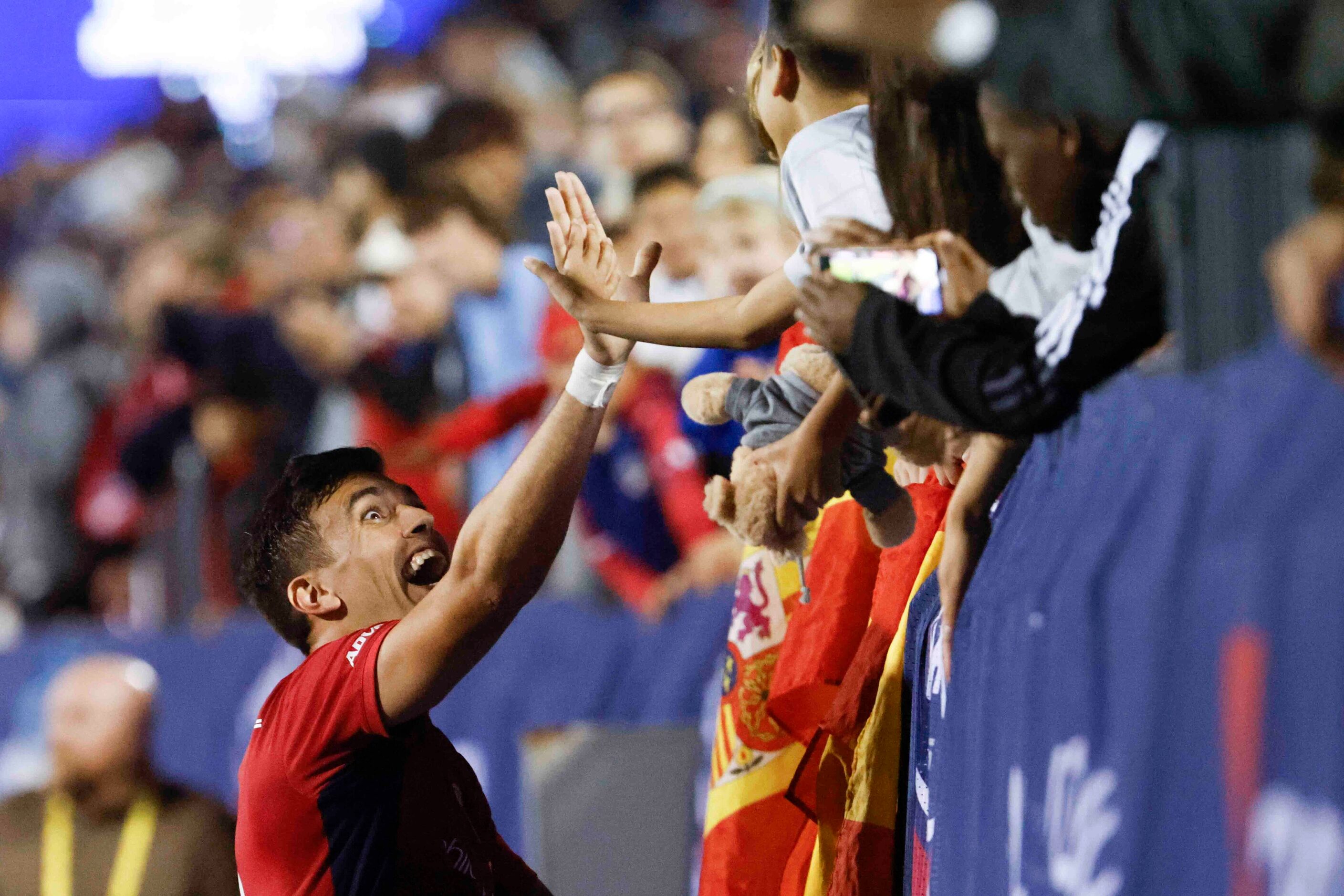 FC Dallas defender José Antonio Martínez hi-fives a fan after a win against LA Galaxy in an...