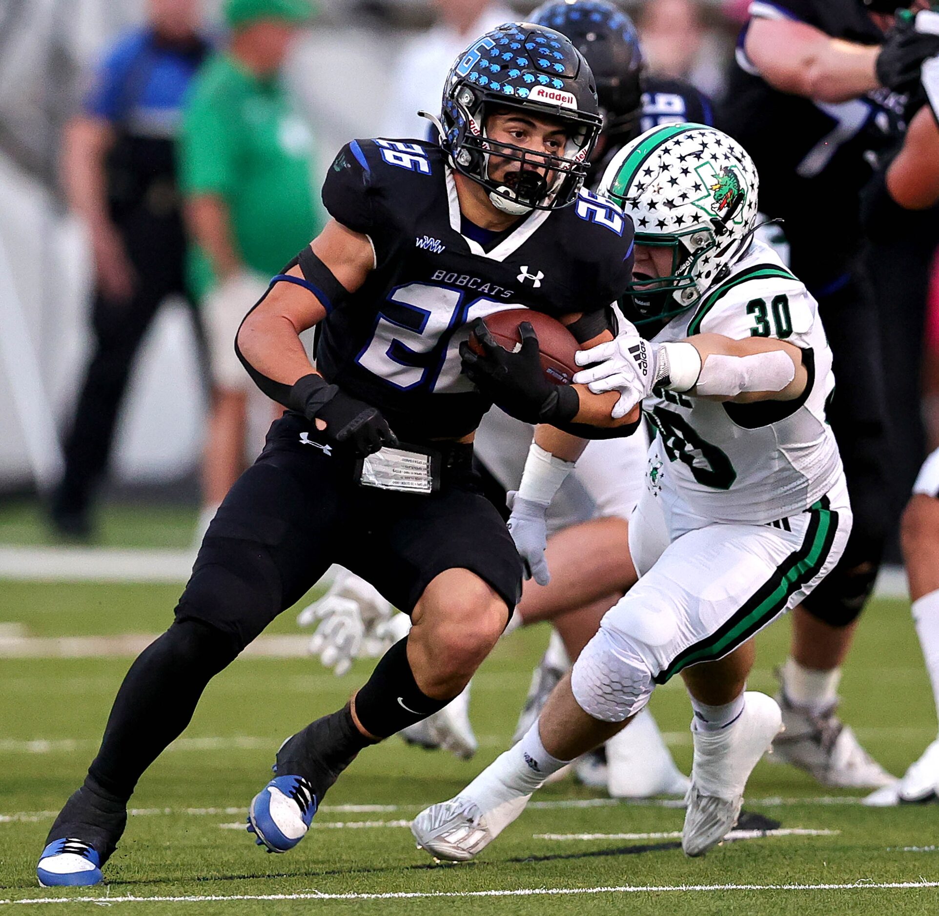 Byron Nelson running back Tucker James (26) finds a nice hole to run past Southlake Carroll...