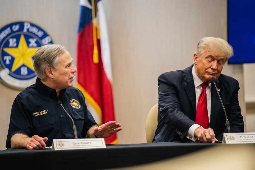 Texas Gov. Greg Abbott addresses former President Donald Trump during a border security...