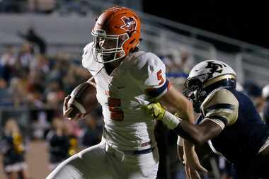 McKinney North's Brandon Frazier (5) scores a touchdown past Little Elm's KJ Richardson...