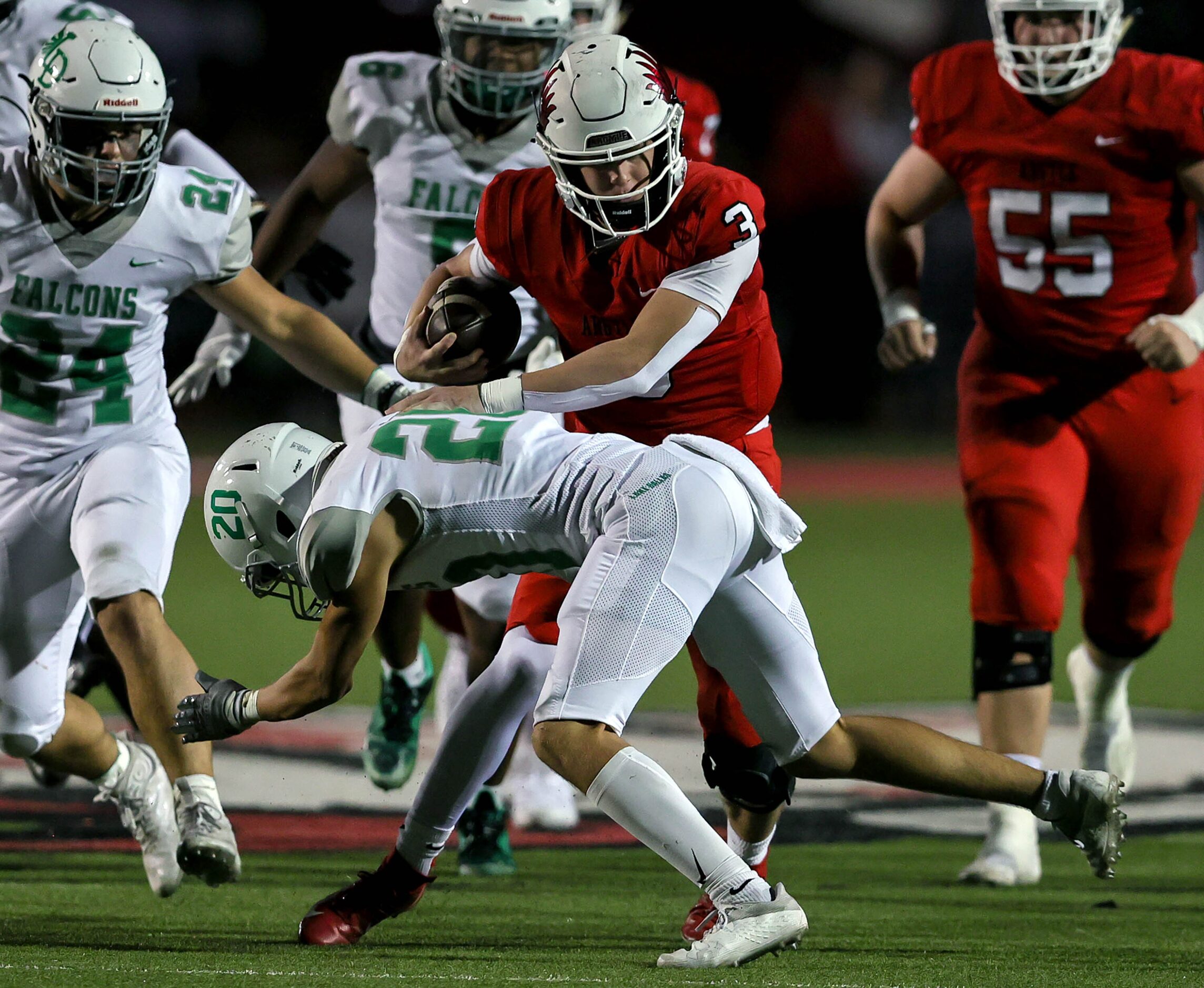 Argyle quarterback Jacob Robinson (3) slips past Lake Dallas defensive back Zach Tipps (20)...