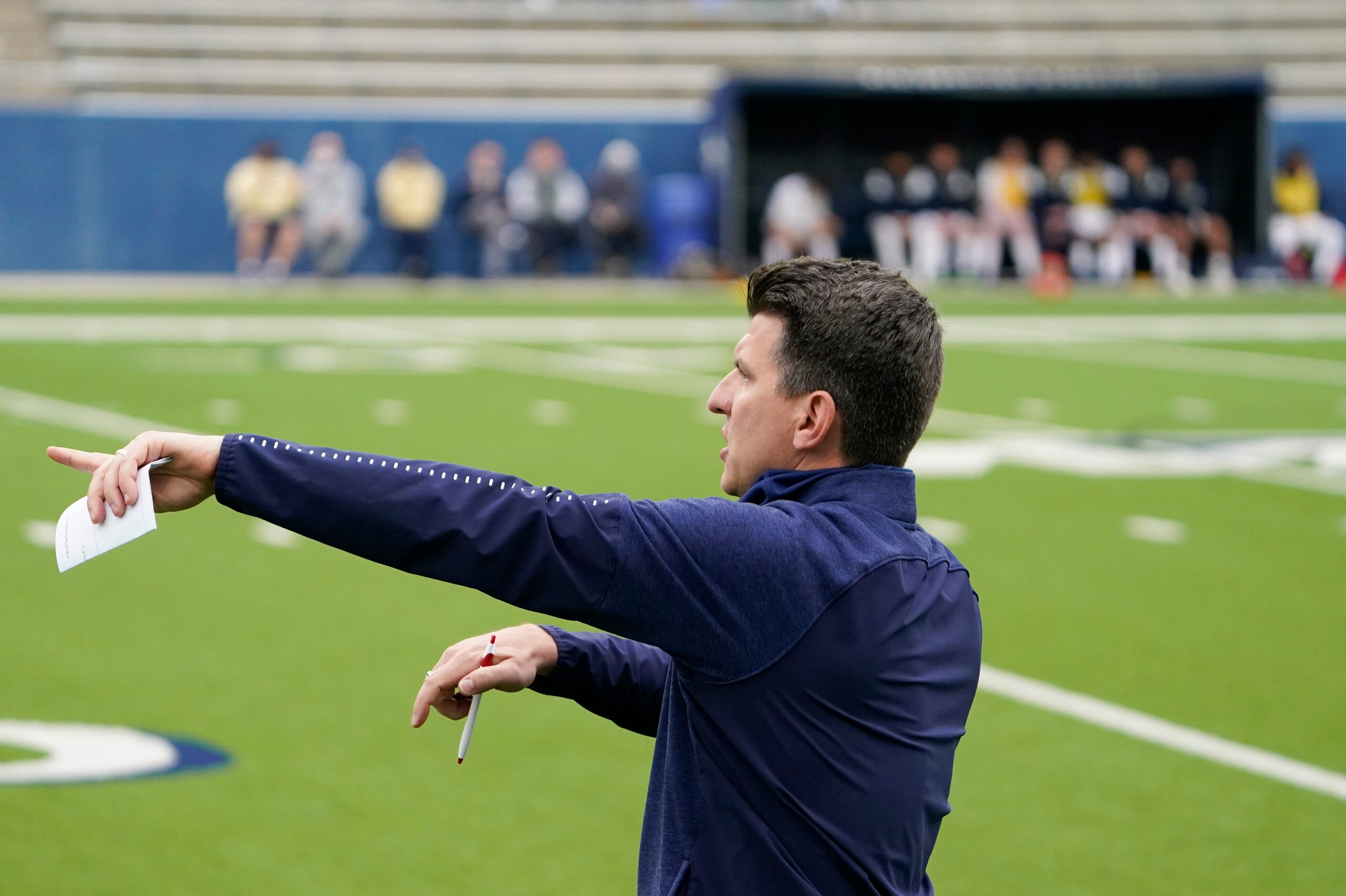 McKinney Boyd head coach Colby Peek directs his team from the sidelines during a Class 6A...