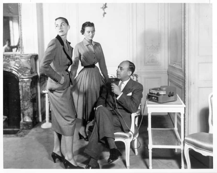 Stanley Marcus (seated) with Neiman Marcus employee Pansy Privitt Johnson (left) and an...