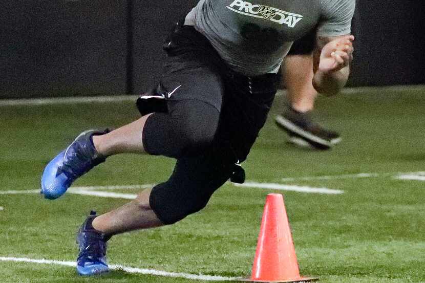 Central Florida's Jordan Akins runs a drill at UCF's Pro Day, Thursday, March 29, 2018, in...