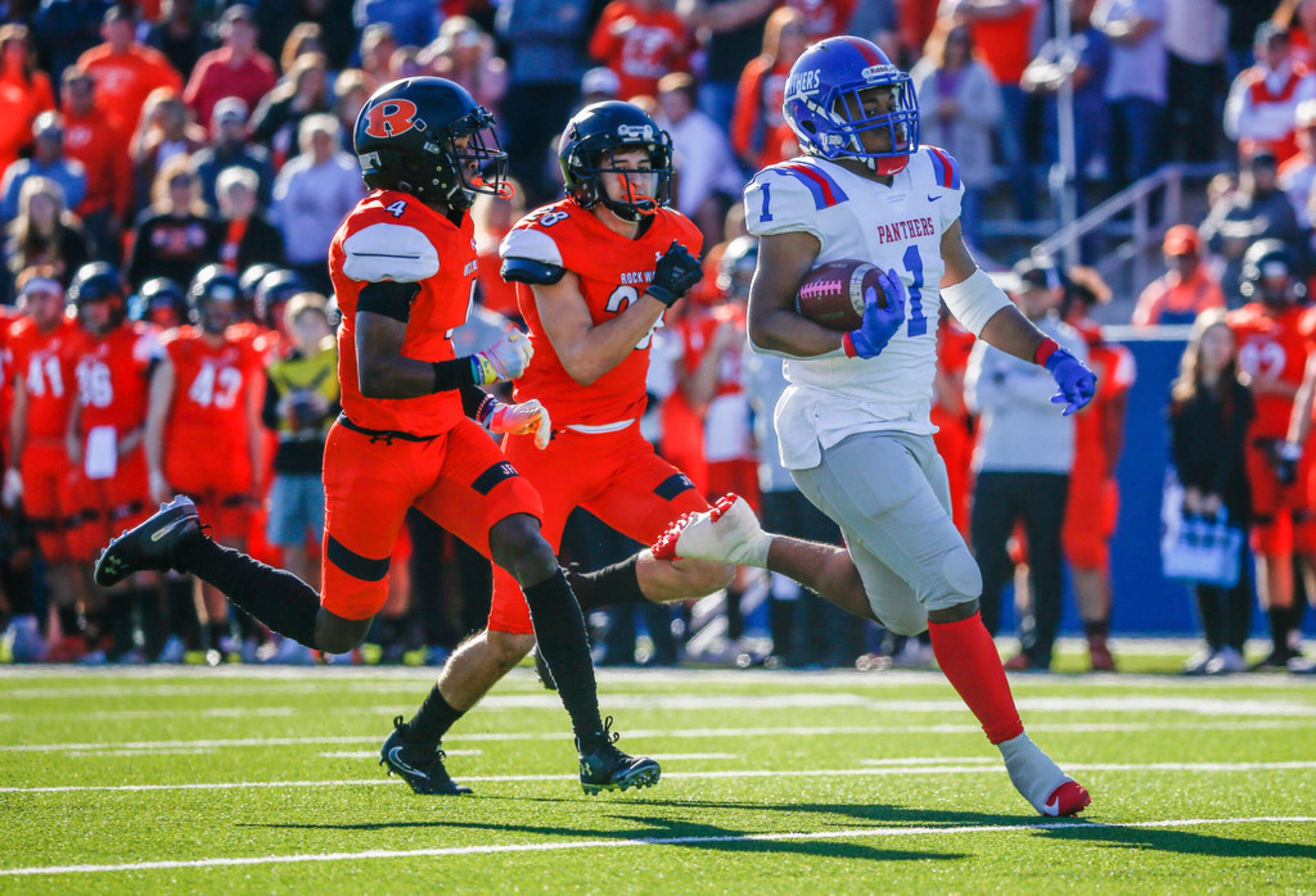 Duncanville running back Trysten Smith (1) breaks away from Rockwall defensive back Cyvon...