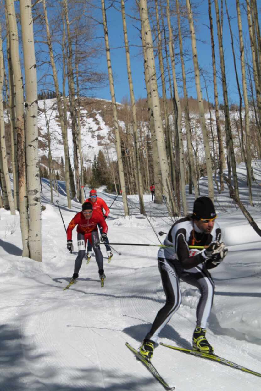 Freestyle skate skiers tackle the course at the Chama Chile Ski Classic & Winter Fiesta. The...