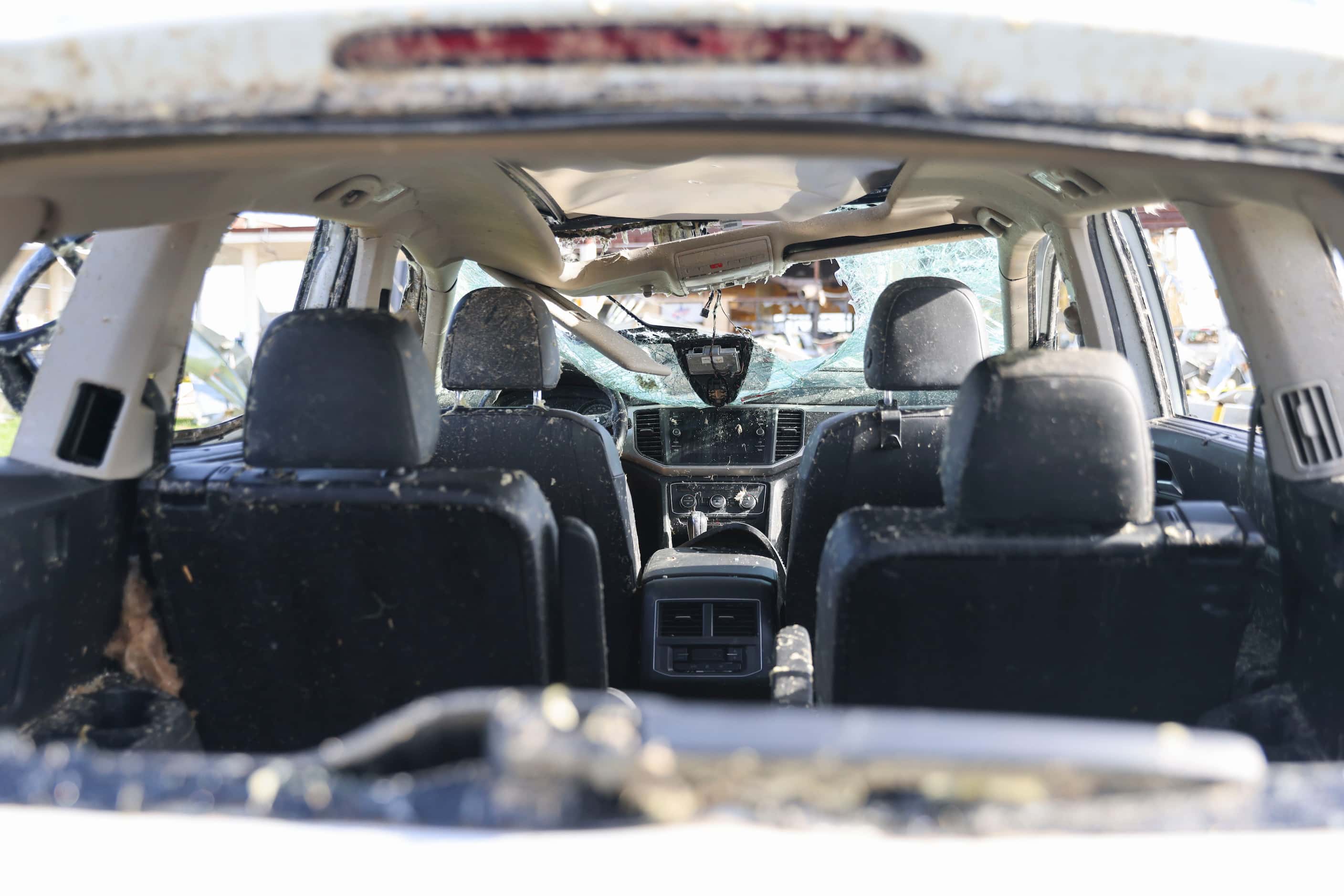 Inside a damaged car on the side of the road by a Shell gas station, on Sunday, May 26,...