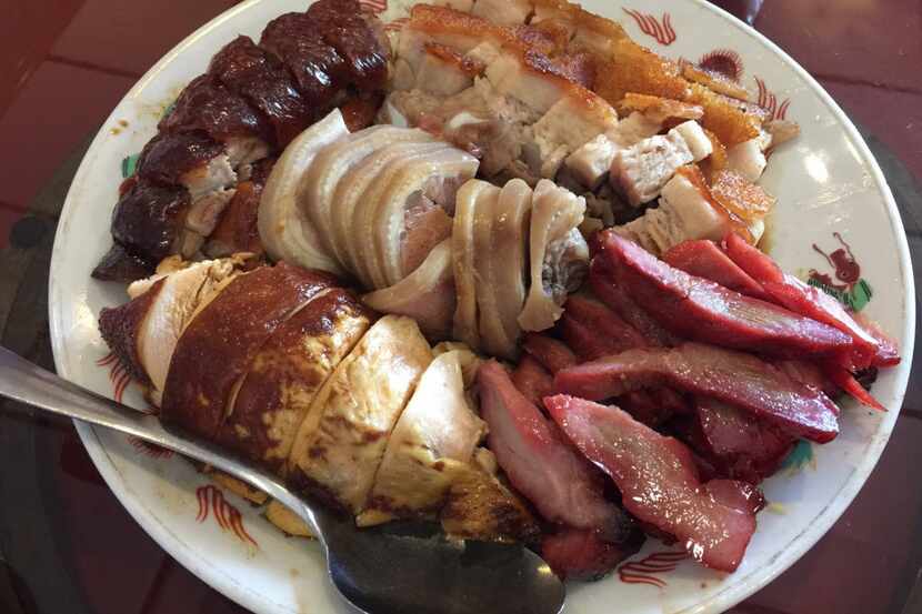 A platter of assorted barbecue at King Chinese BBQ in Arlington. King is the favorite place...