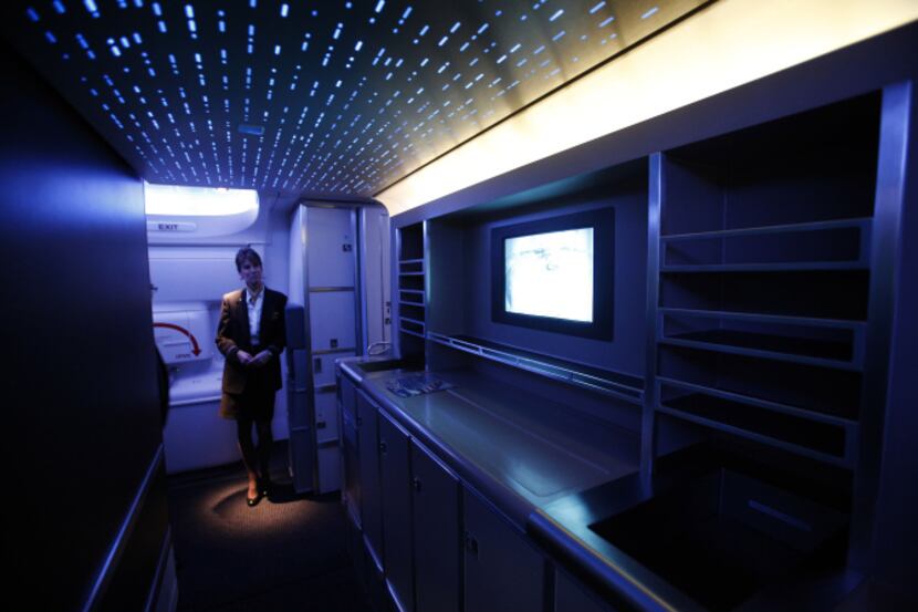 Flight attendant Jodie Lemish stands in one of the aisles of American Airlines' first Boeing...