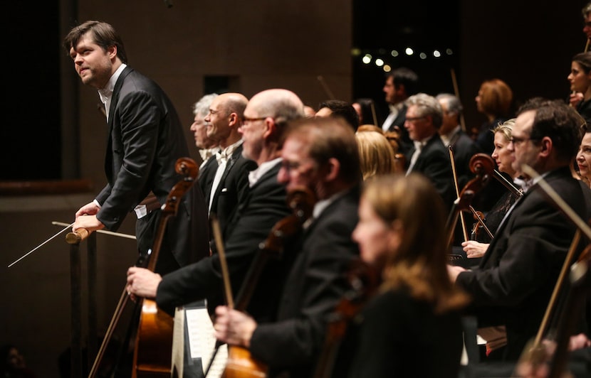 Guest conductor Juraj Valcuha takes a bow with the Dallas Symphony Orchestra's performance...