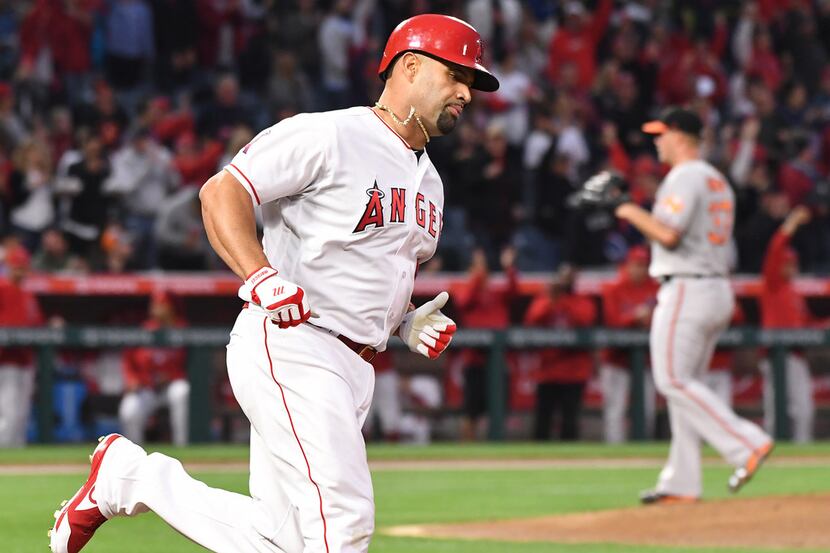 In a June 2016 file image, he Los Angeles Angels' Albert Pujols rounds first base after...
