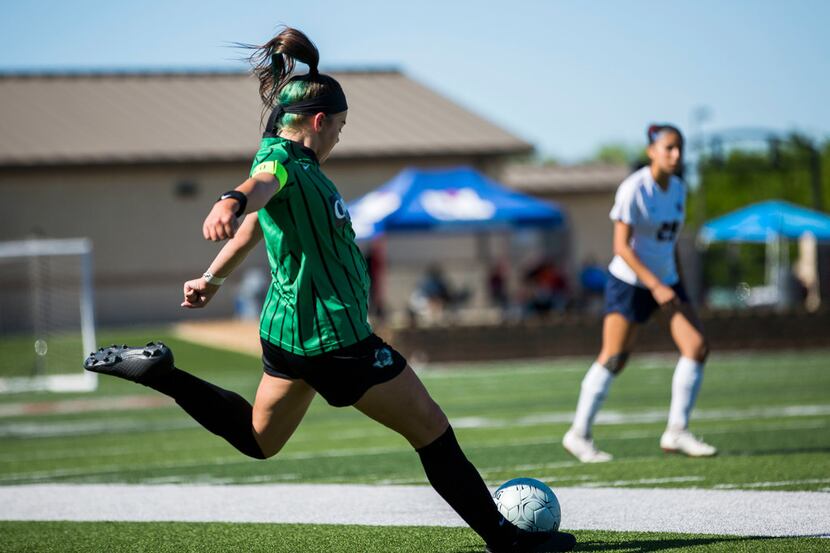 Southlake Carroll forward Taylor Tufts (4) kicks the ball during theÂ UIL conference 6A...