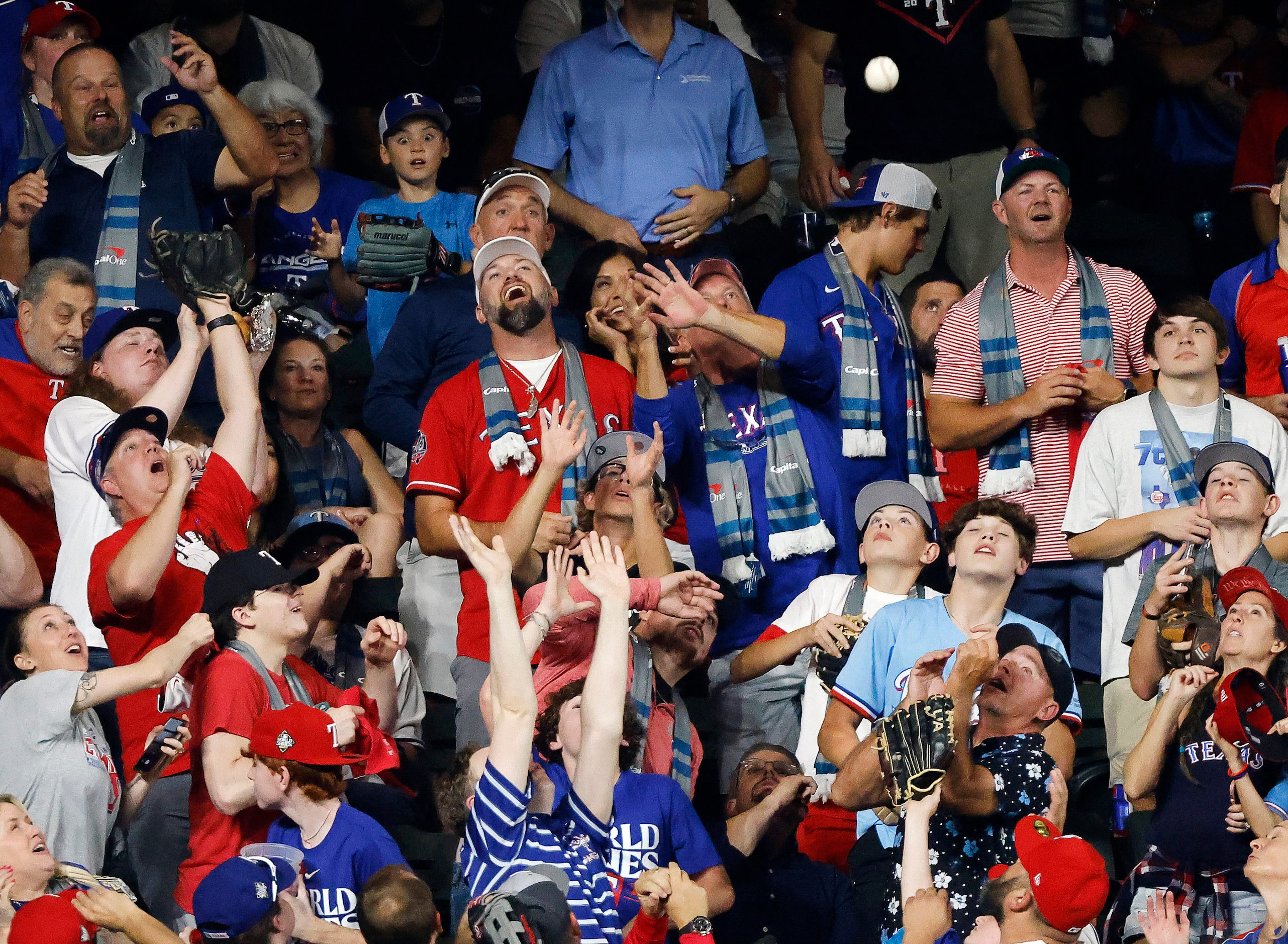 Fans react as a solo home run by Arizona Diamondbacks' Tommy Pham lands in the left field...