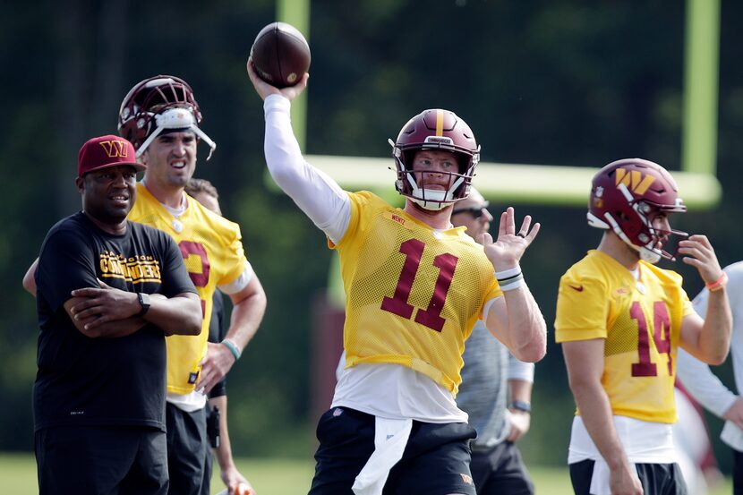 Washington Commanders quarterback Carson Wentz (11) throws a pass during an NFL football...