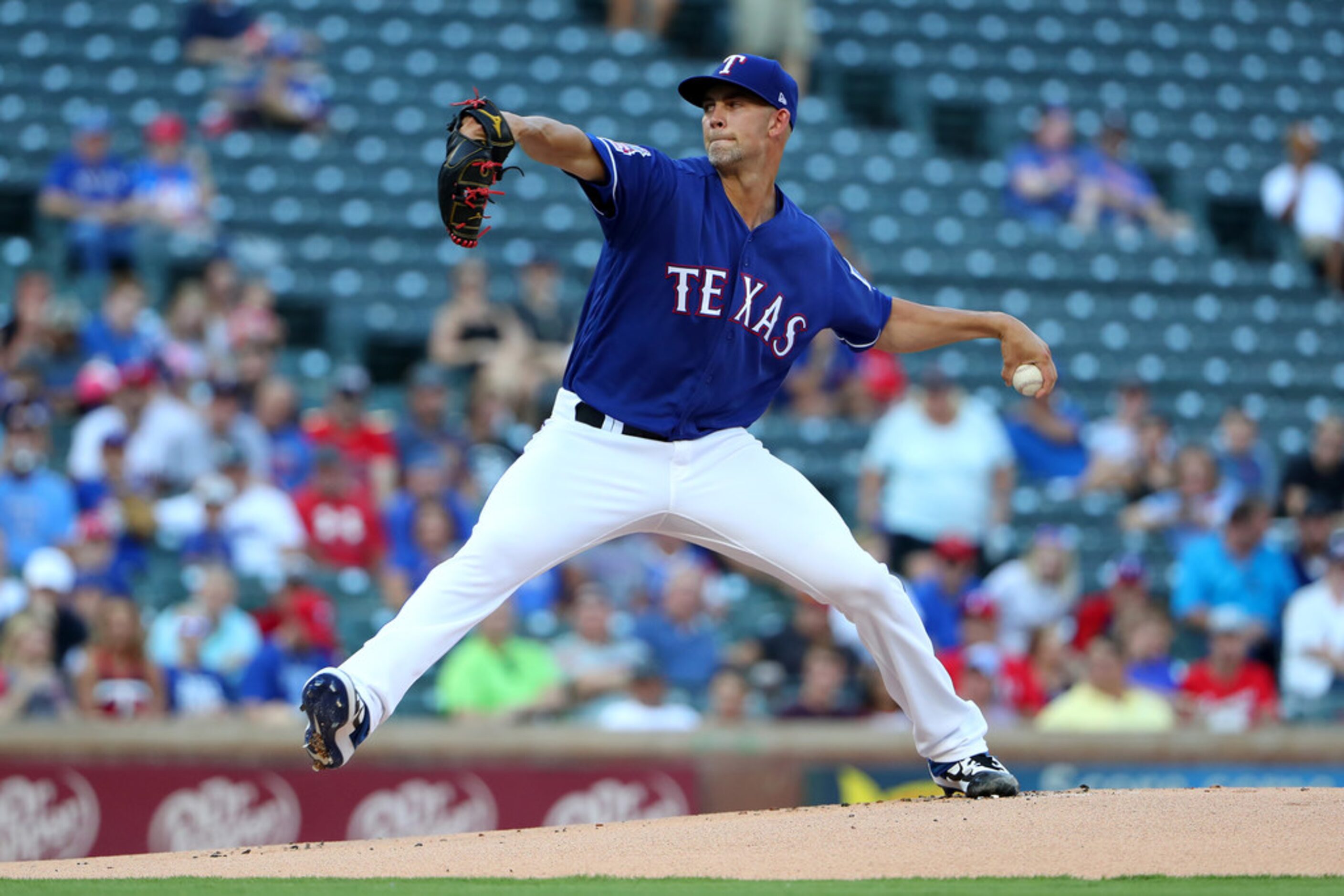 ARLINGTON, TEXAS - AUGUST 16: Mike Minor #23 of the Texas Rangers pitches against the...