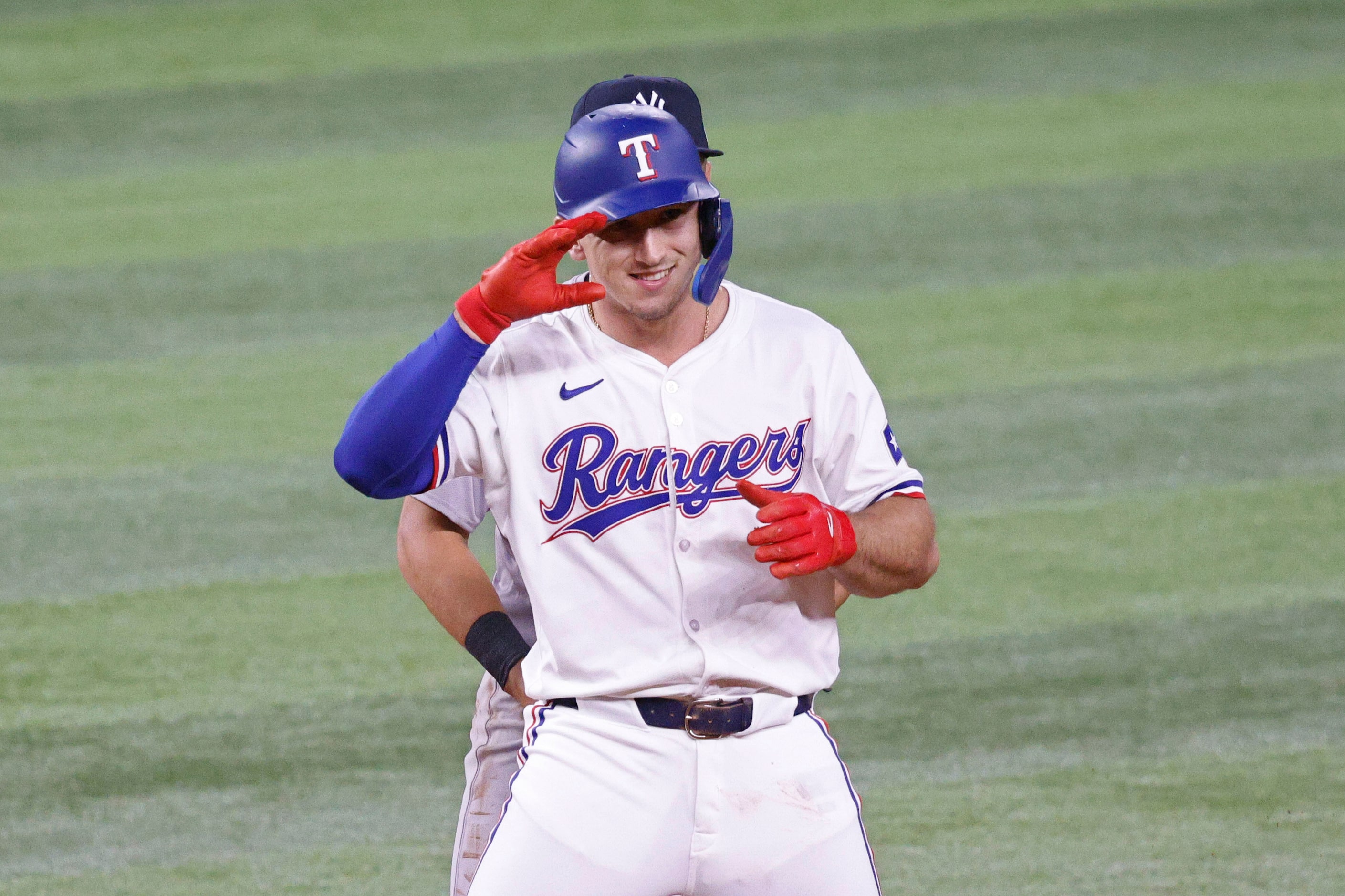 Texas Rangers’ Wyatt Langford (36) gestures after hitting a double during the fourth inning...