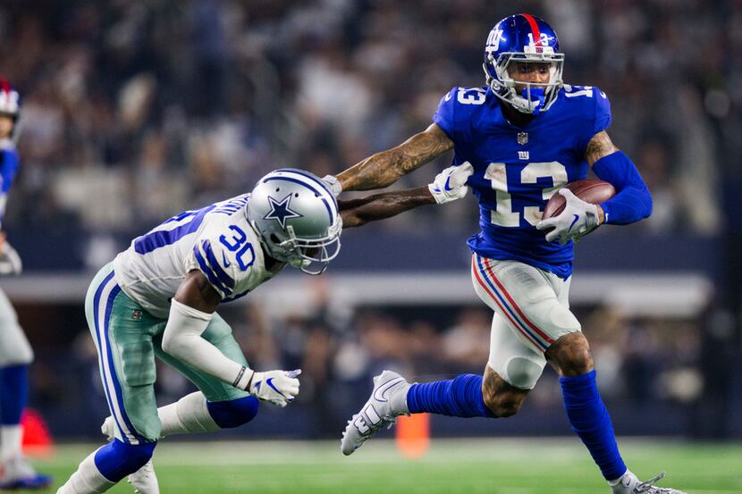 Dallas Cowboys cornerback Anthony Brown (30) tackles New York Giants wide receiver Odell...