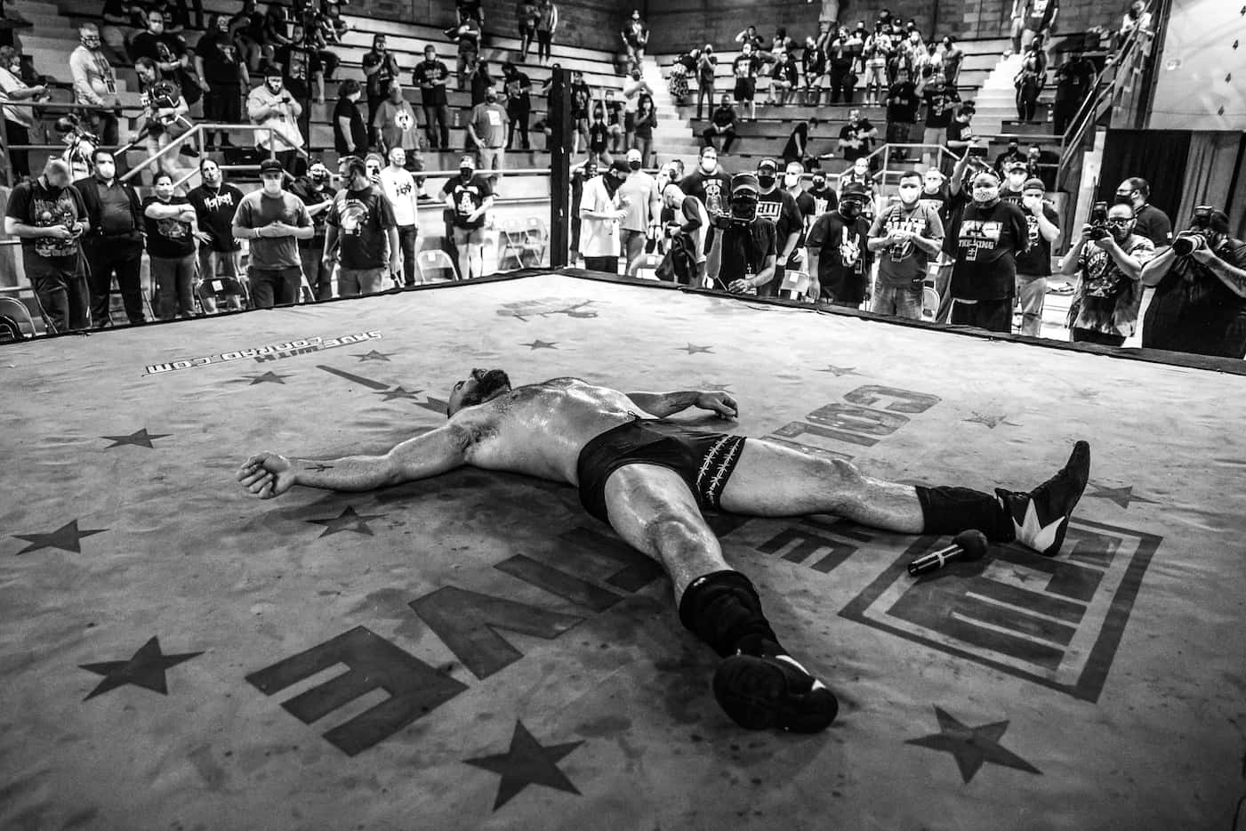 An exhausted Jon Moxley lies in the ring after his match at Game Changer Wrestling's...