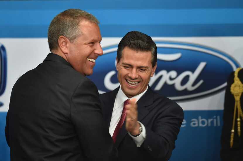 Mexican President Enrique Pena Nieto (R) and the president for the Americas of Ford Motor...