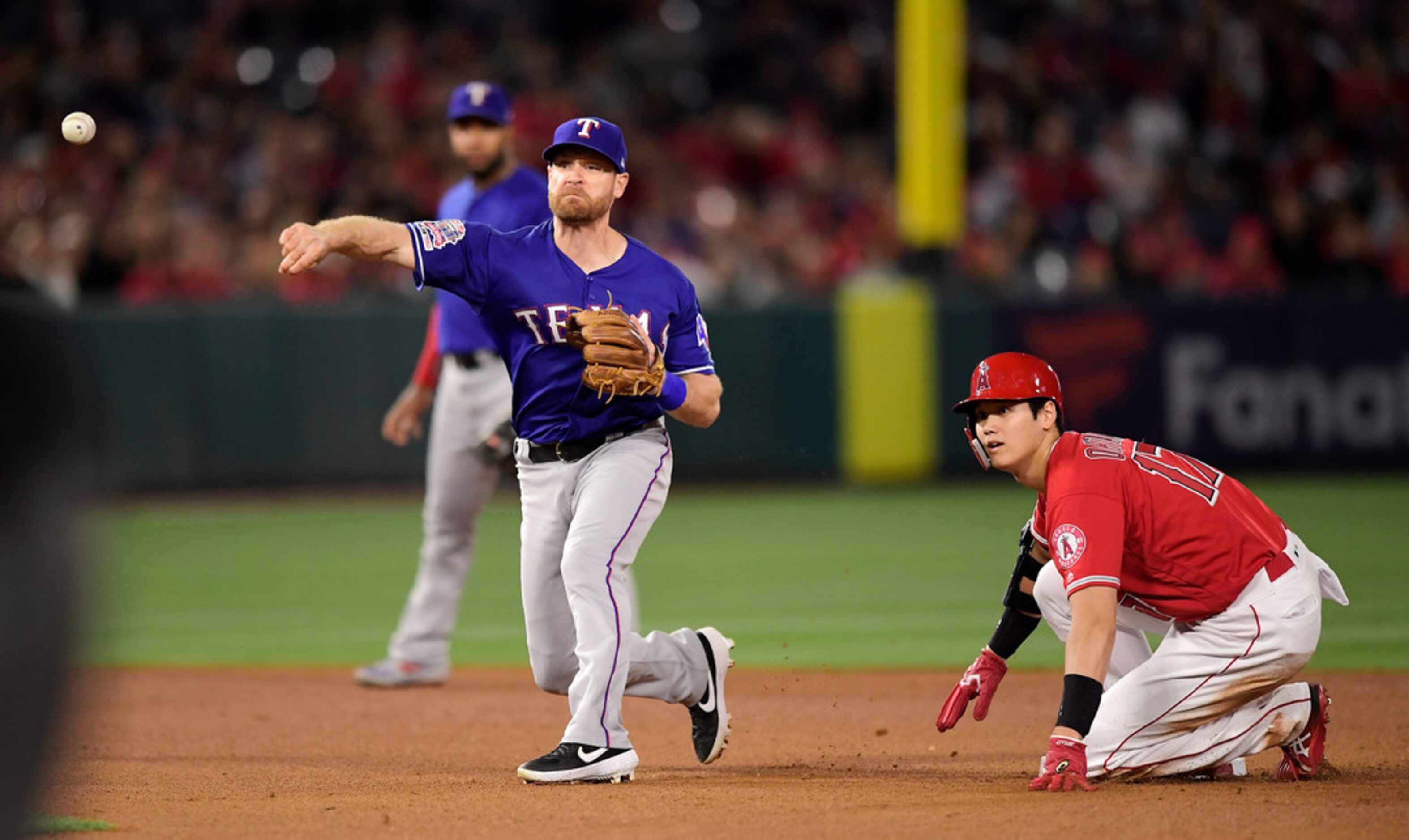 Los Angeles Angels' Shohei Ohtani, of Japan, looks back after being forced out at second as...