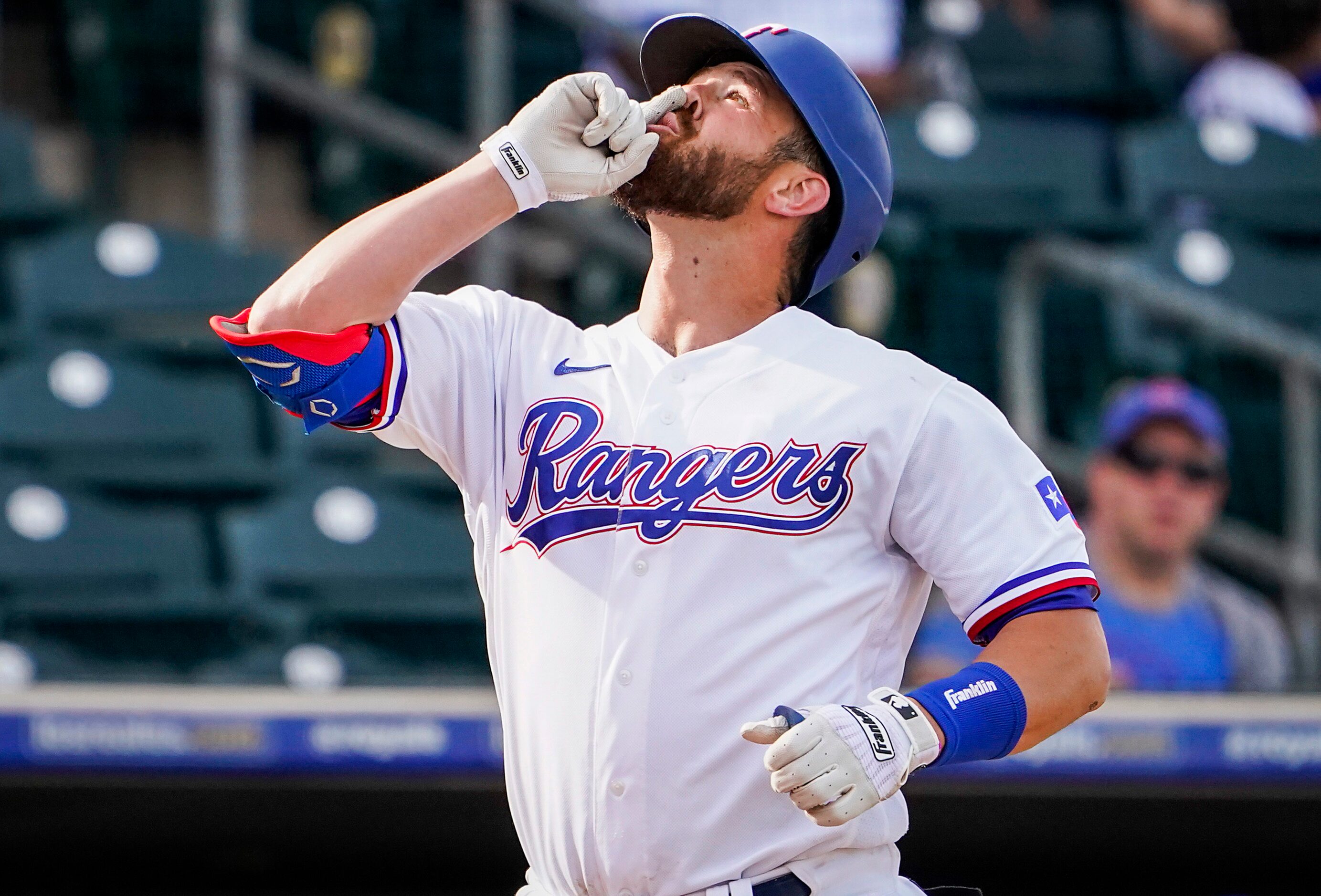 Texas Rangers catcher Nick Ciuffo celebrates as he rounds the bases after hitting a home run...