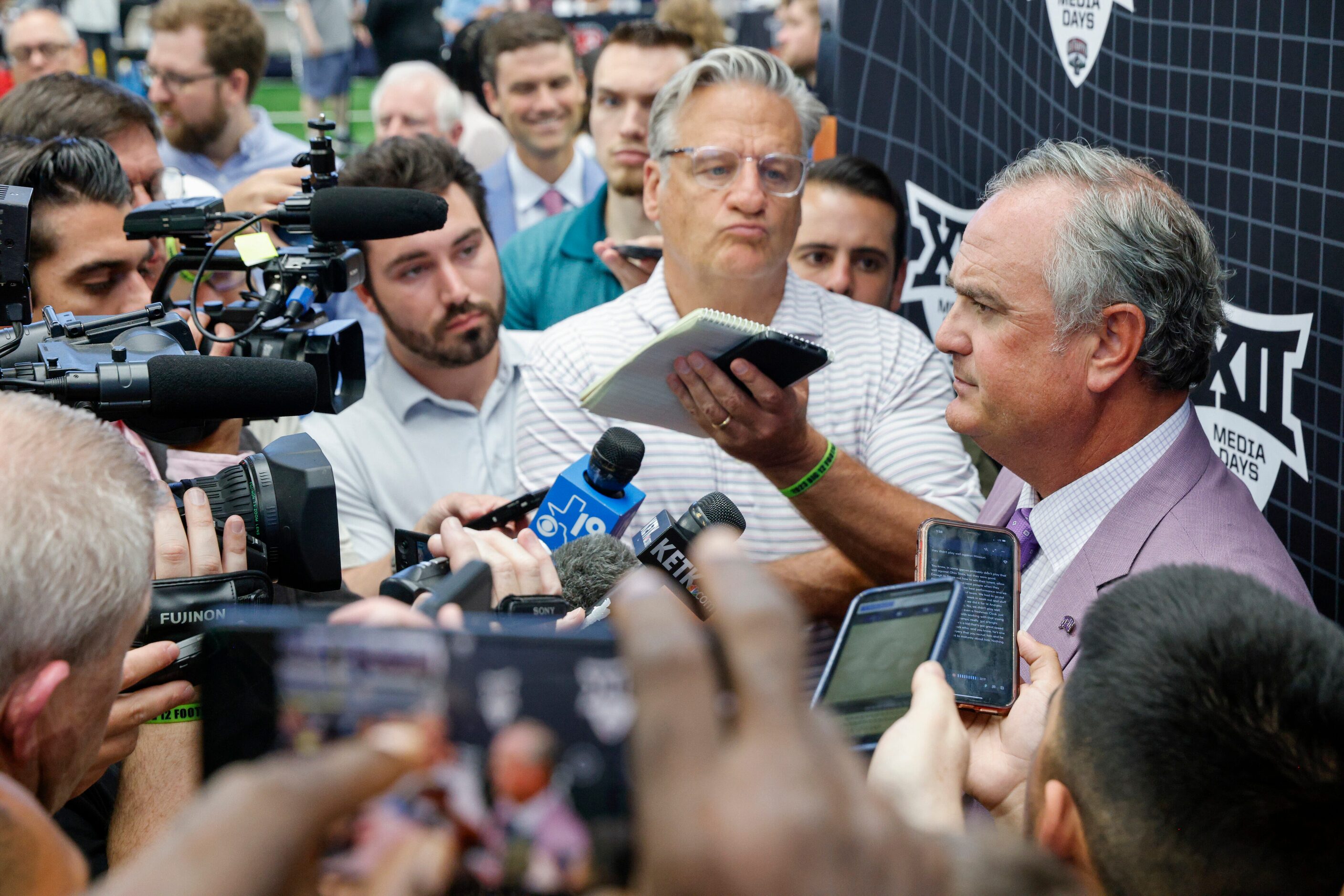 TCU head coach Sonny Dykes listens to questions from reporters during the Big 12 Media Days...