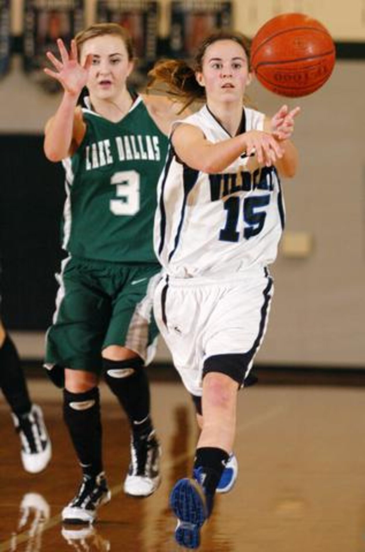 Guyer's Courtney Gregory (15) makes a pass as Lake Dallas' Hailey Broderick (3) tries to...